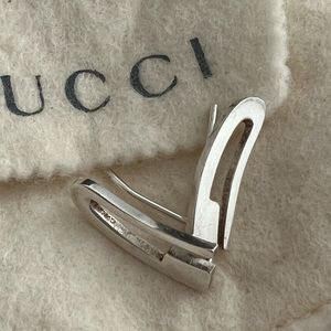 GUCCI Sterling Silver pierced “G” Logo earring.